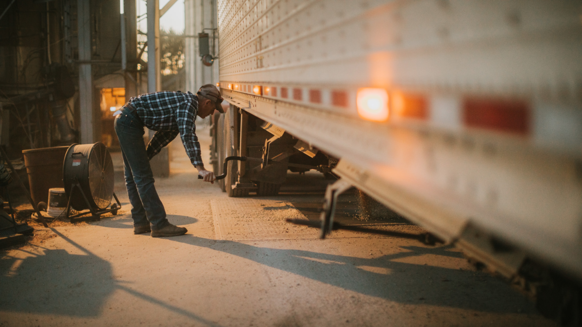 Farmer Unloading Soybeans From Semi Trailer